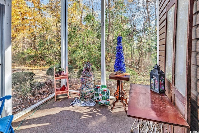 unfurnished sunroom featuring a wealth of natural light