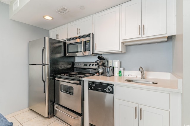 kitchen featuring white cabinets, sink, and appliances with stainless steel finishes