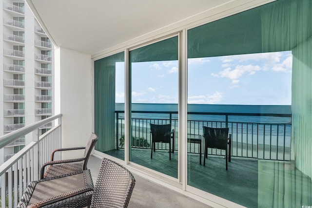 balcony featuring a water view