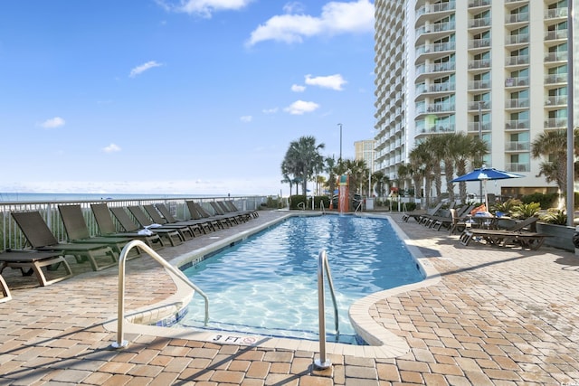 view of swimming pool featuring a patio