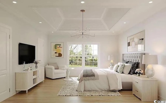 bedroom with a chandelier, a tray ceiling, light wood-style flooring, and recessed lighting