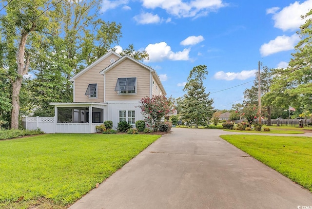 613 Lee Ave, Murrells Inlet, SC 29576 - traditional home featuring driveway and a sunroom