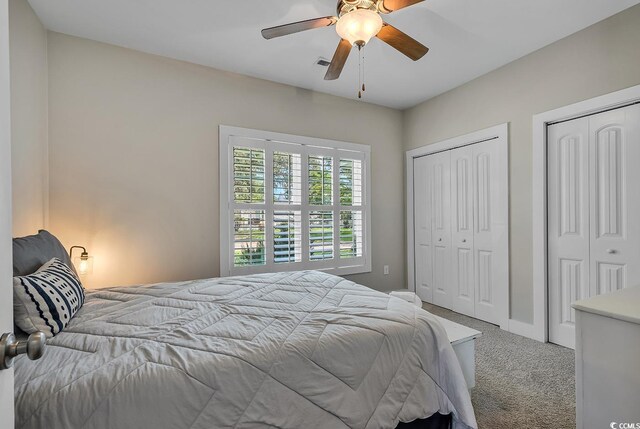 613 Lee Ave, Murrells Inlet, SC 29576 - bedroom featuring carpet flooring, two closets, and a ceiling fan