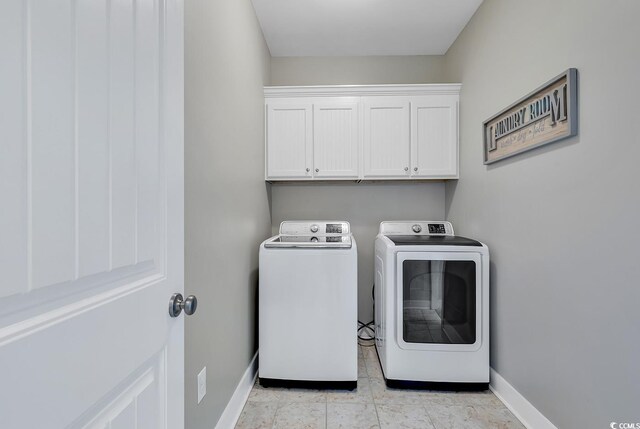 613 Lee Ave, Murrells Inlet, SC 29576 - washroom with washer and clothes dryer, cabinet space, and baseboards