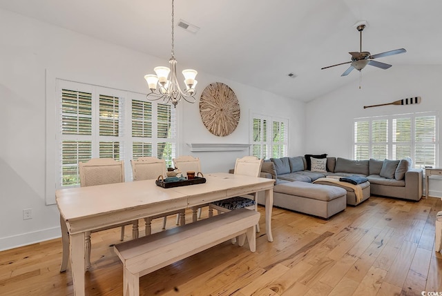 613 Lee Ave, Murrells Inlet, SC 29576 - dining area with a chandelier, light wood-style flooring, ceiling fan, baseboards, and high vaulted ceiling