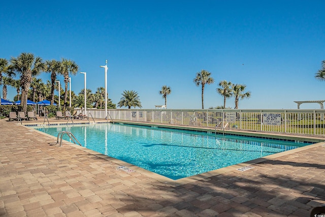 view of swimming pool with a patio area