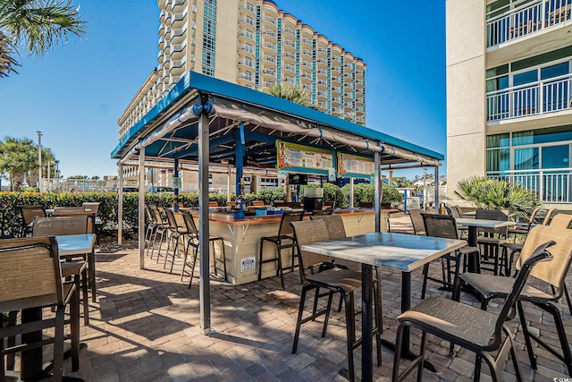 view of patio with a bar