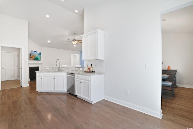 kitchen featuring white cabinets, dishwasher, sink, kitchen peninsula, and ceiling fan