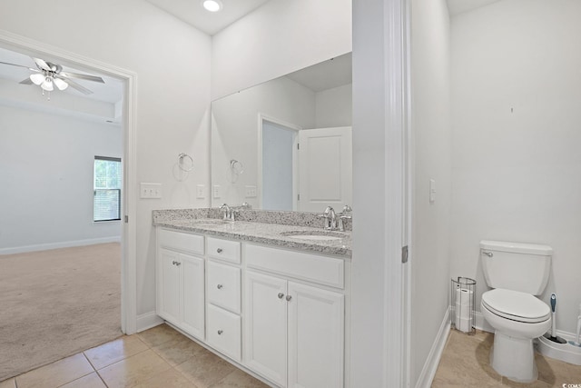 bathroom featuring ceiling fan, tile patterned floors, vanity, and toilet