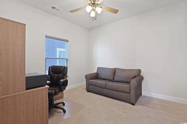 carpeted office with ceiling fan