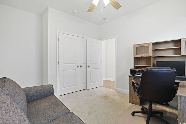 office with ceiling fan and light colored carpet