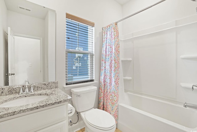 full bathroom featuring toilet, vanity, shower / tub combo with curtain, and a healthy amount of sunlight