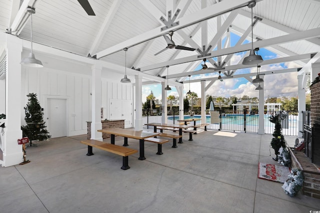 view of patio featuring ceiling fan and a community pool