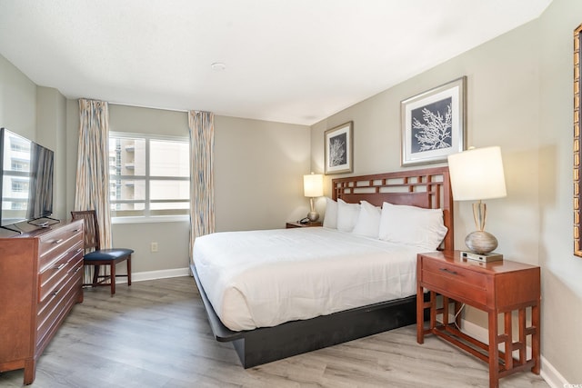 bedroom with light hardwood / wood-style floors