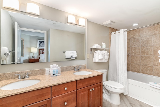 full bathroom with shower / tub combo with curtain, vanity, hardwood / wood-style floors, and toilet