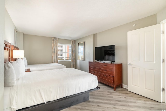 bedroom with light hardwood / wood-style flooring