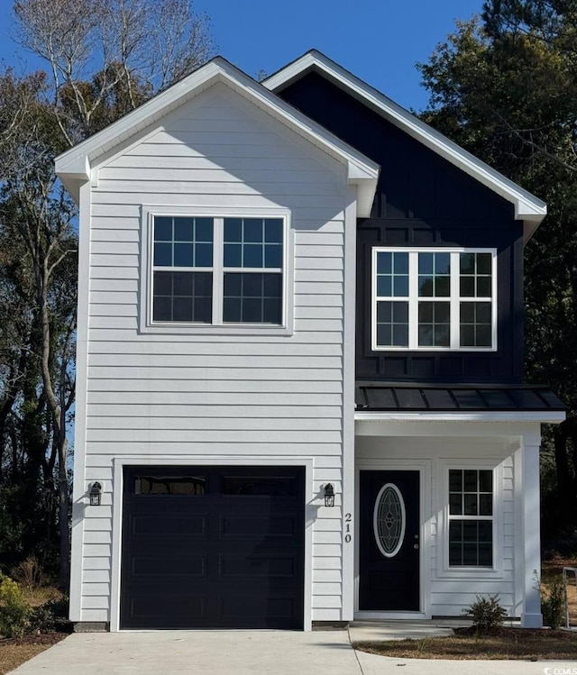 210 26th Ave S, Myrtle Beach, SC 29577 - traditional home featuring an attached garage, a standing seam roof, metal roof, and concrete driveway