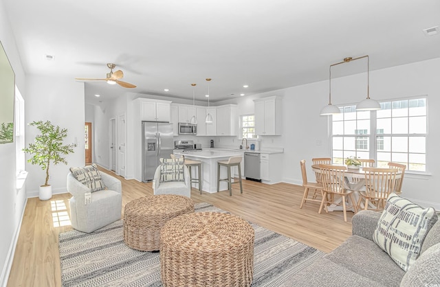 210 26th Ave S, Myrtle Beach, SC 29577 - living area with recessed lighting, light wood-style flooring, baseboards, and ceiling fan