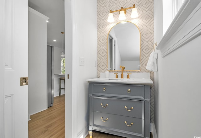 210 26th Ave S, Myrtle Beach, SC 29577 - bathroom with baseboards, vanity, and wood finished floors