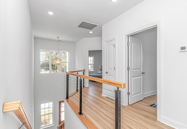210 26th Ave S, Myrtle Beach, SC 29577 - hall with a notable chandelier, an upstairs landing, visible vents, and recessed lighting