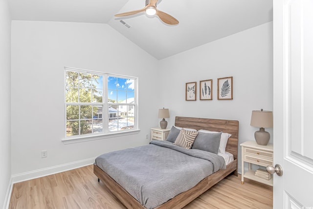 210 26th Ave S, Myrtle Beach, SC 29577 - bedroom featuring lofted ceiling, visible vents, a ceiling fan, light wood-style floors, and baseboards