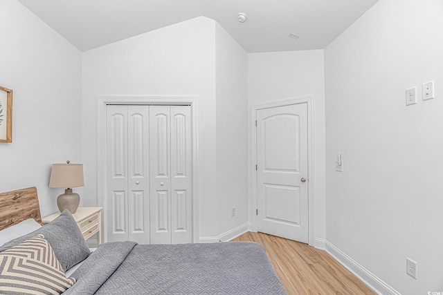210 26th Ave S, Myrtle Beach, SC 29577 - bedroom with light wood-style flooring, baseboards, and a closet