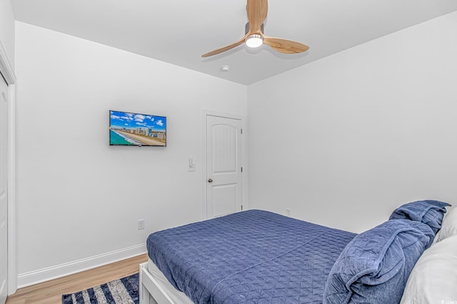 210 26th Ave S, Myrtle Beach, SC 29577 - bedroom featuring baseboards, a ceiling fan, and light wood finished floors