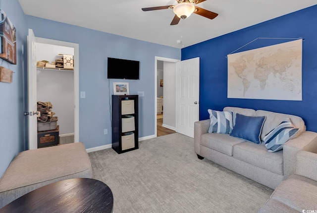 living room featuring ceiling fan and light carpet