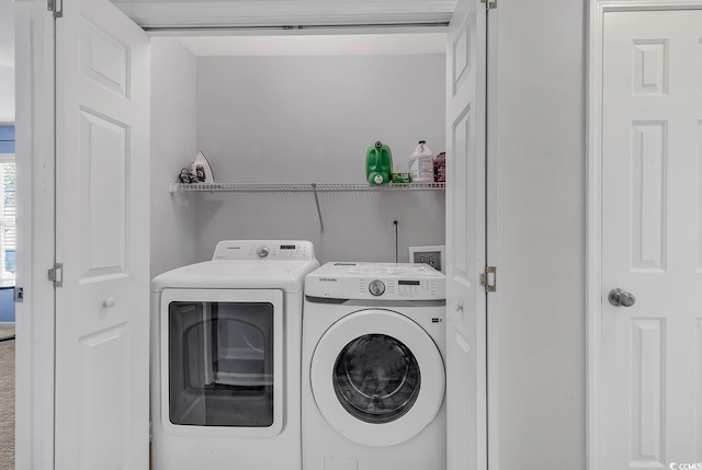 laundry room with separate washer and dryer