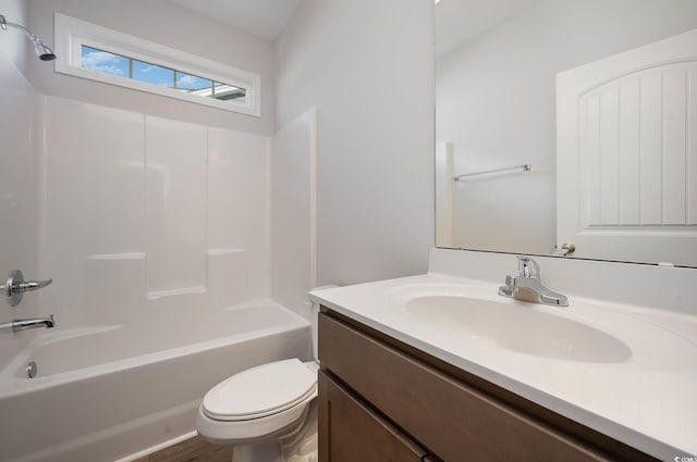 full bathroom featuring vanity, tub / shower combination, and toilet