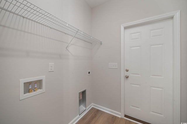 washroom with electric dryer hookup, hardwood / wood-style floors, and hookup for a washing machine