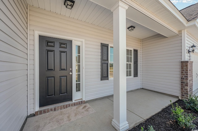 entrance to property featuring a porch