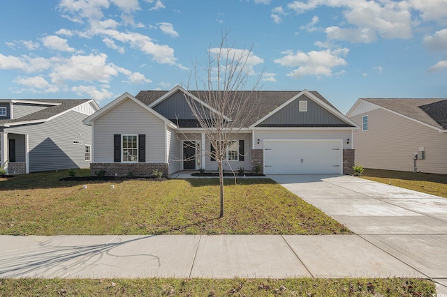 view of front of house featuring a garage and a front yard