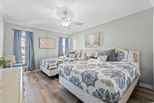 bedroom featuring multiple windows, wood-type flooring, ceiling fan, and ornamental molding