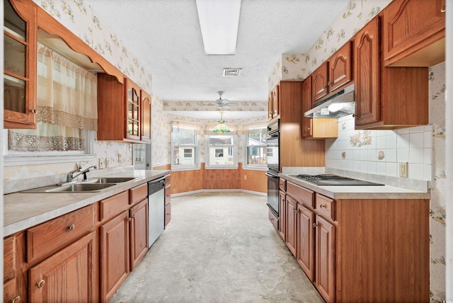 kitchen featuring black appliances, ceiling fan, sink, and a textured ceiling