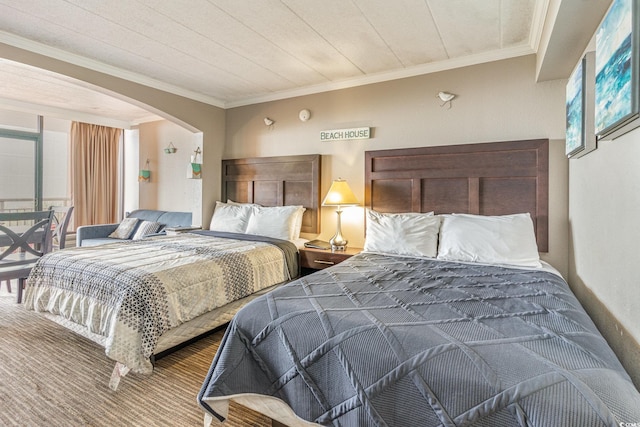 bedroom featuring multiple windows and crown molding