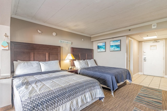 bedroom with crown molding and light tile patterned flooring