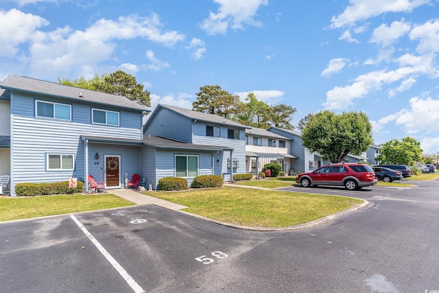 775 Plantation Dr Unit 59, Little River, SC 29566 - view of front of property featuring uncovered parking, a front yard, and a residential view