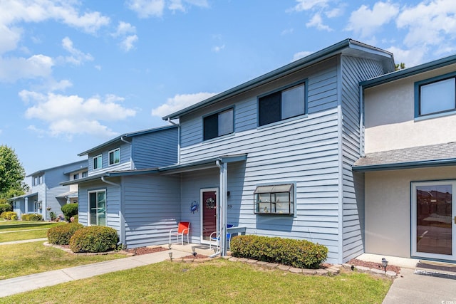 775 Plantation Dr Unit 59, Little River, SC 29566 - view of front facade featuring a front lawn and stucco siding