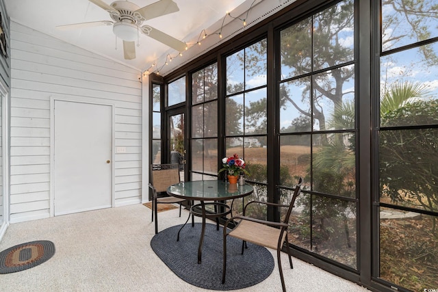 775 Plantation Dr Unit 59, Little River, SC 29566 - sunroom featuring lofted ceiling, a ceiling fan, carpet flooring, and wooden walls