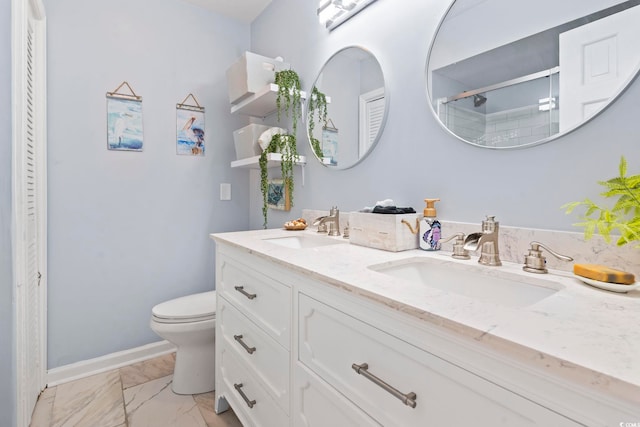 bathroom featuring walk in shower, vanity, and toilet