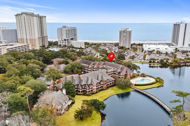 birds eye view of property featuring a water view