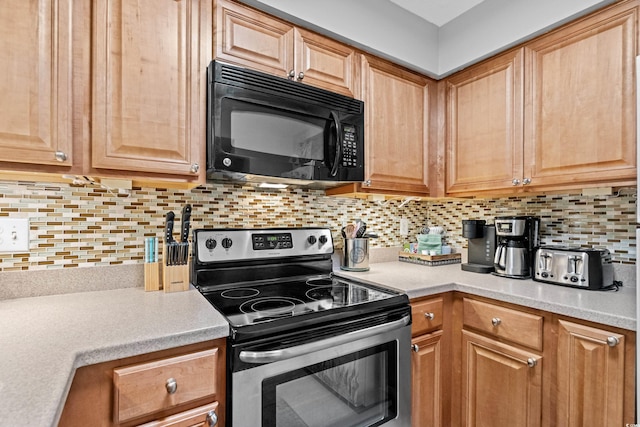 kitchen featuring stainless steel range with electric cooktop and tasteful backsplash