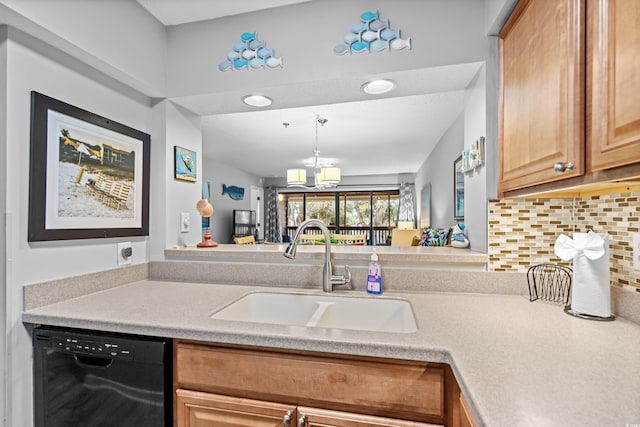 kitchen with sink, hanging light fixtures, an inviting chandelier, black dishwasher, and backsplash