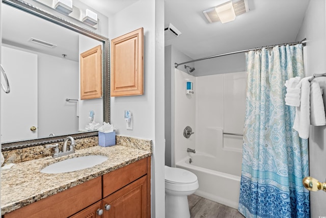 full bathroom with shower / bath combo, vanity, toilet, and wood-type flooring