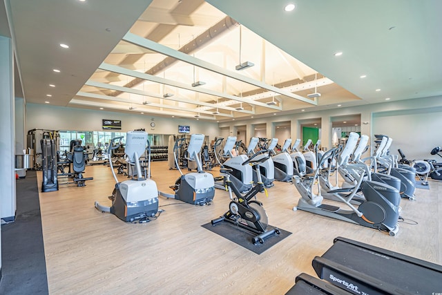 exercise room featuring hardwood / wood-style floors