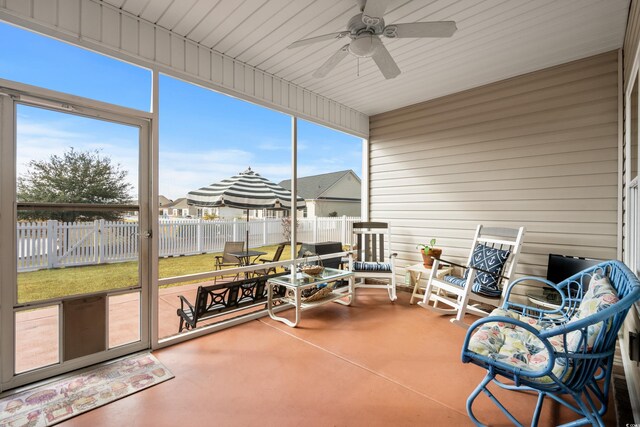 sunroom / solarium with ceiling fan