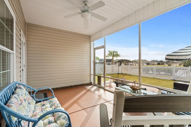 sunroom / solarium with ceiling fan