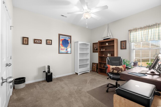 office space with ceiling fan and light carpet