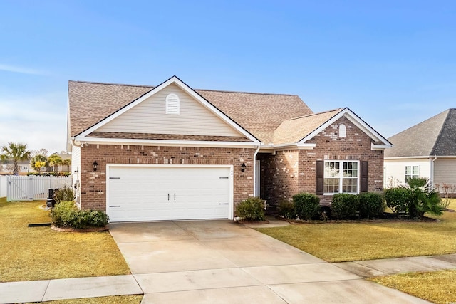 view of front of property with a garage and a front yard